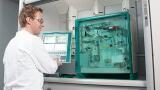 Monitoring water in gaseous monomers and liquefied gases