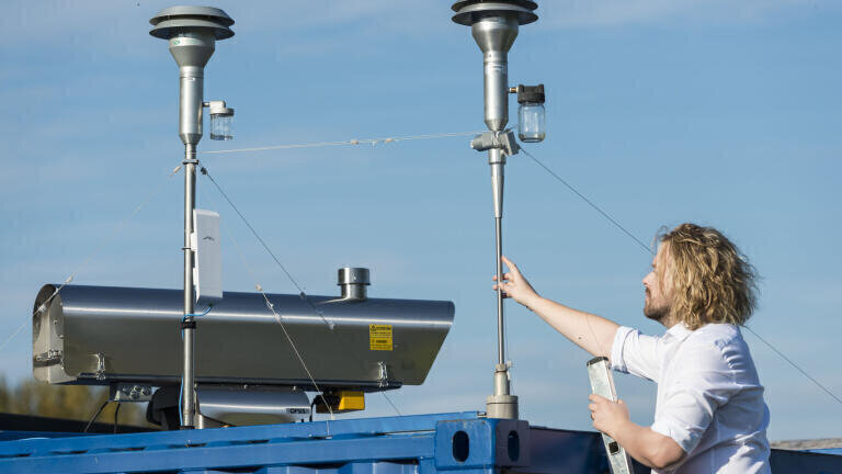 Dr Kevin Wyche, one of the project's lead scientists, with the air monitoring station