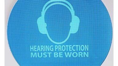 Weatherproof noise-activated hearing protection signs
