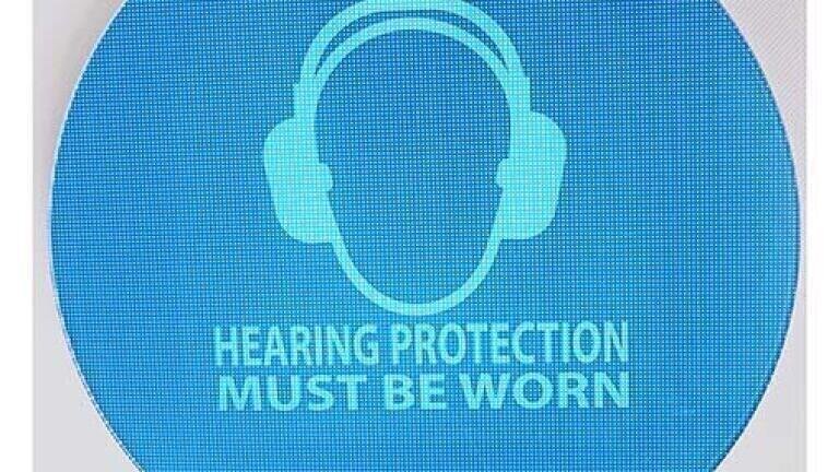 Weatherproof noise-activated hearing protection signs