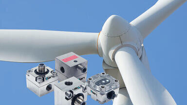 How do you monitor grease lubrication flow in wind turbines?