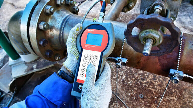 Non-invasive clamp-on flowmeters