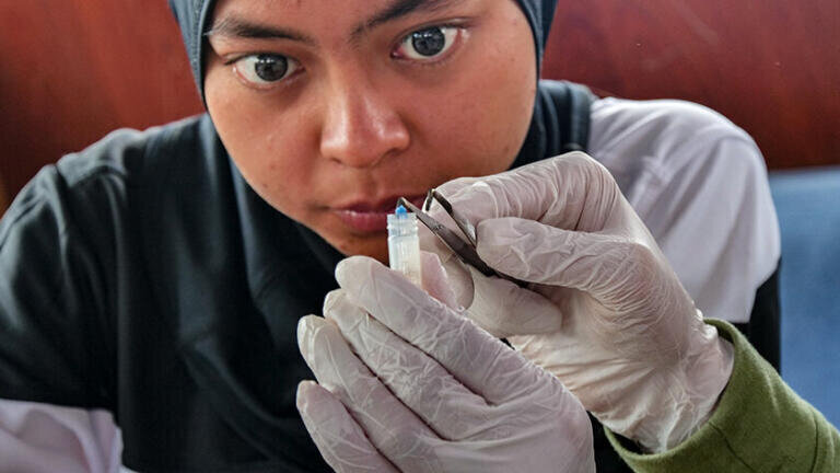 Crew member studying microplastic (Picture Credit eXXpedition and Nomad Neumonics)
