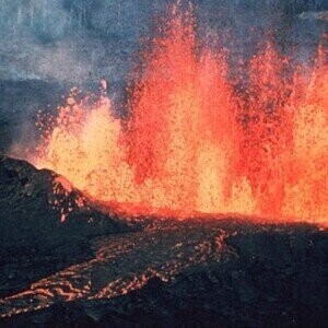 What particles do volcanic eruptions emit?